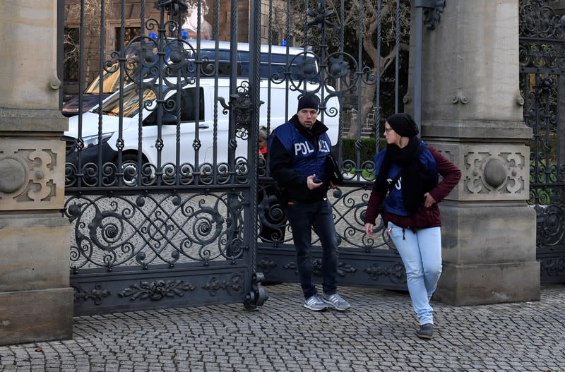 Police offciers leave Green Vault city palace after a robery in Dresden