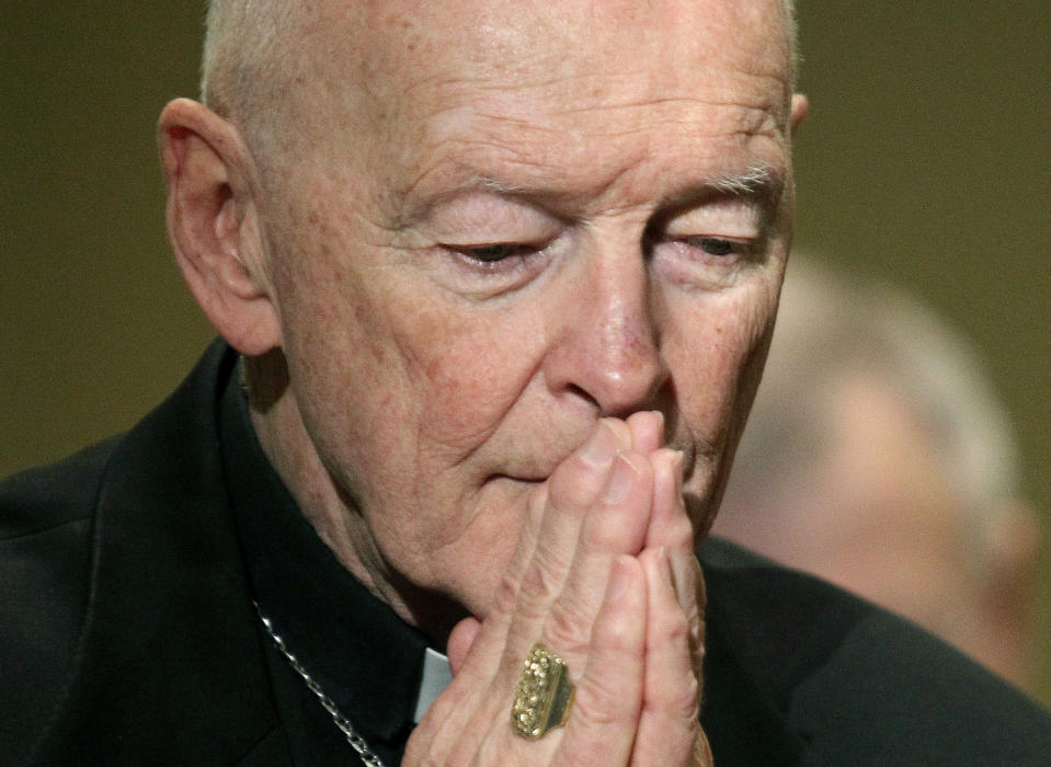 FILE - In this Nov. 14, 2011 file photo, Cardinal Theodore McCarrick prays during the United States Conference of Catholic Bishops' annual fall assembly in Baltimore. On Tuesday, Nov. 10, 2020, the Vatican is taking the extraordinary step of publishing its two-year investigation into the disgraced ex-Cardinal McCarrick, who was defrocked in 2019 after the Vatican determined that years of rumors that he was a sexual predator were true. (AP Photo/Patrick Semansky, File)