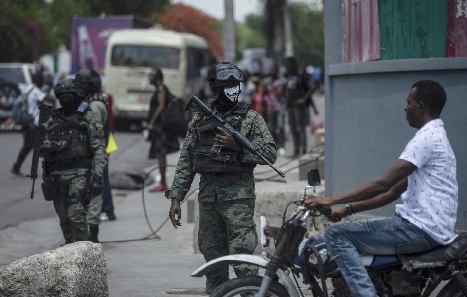 Armed forces secure the area of ​​state offices of Port-au-Prince, Haiti, Monday, July 11, 2022. Radio TV Caraibe, a popular radio station in Haiti announced that it would stop broadcasting for one week to protest widespread violence in the capital. (AP Photo/Odelyn Joseph)