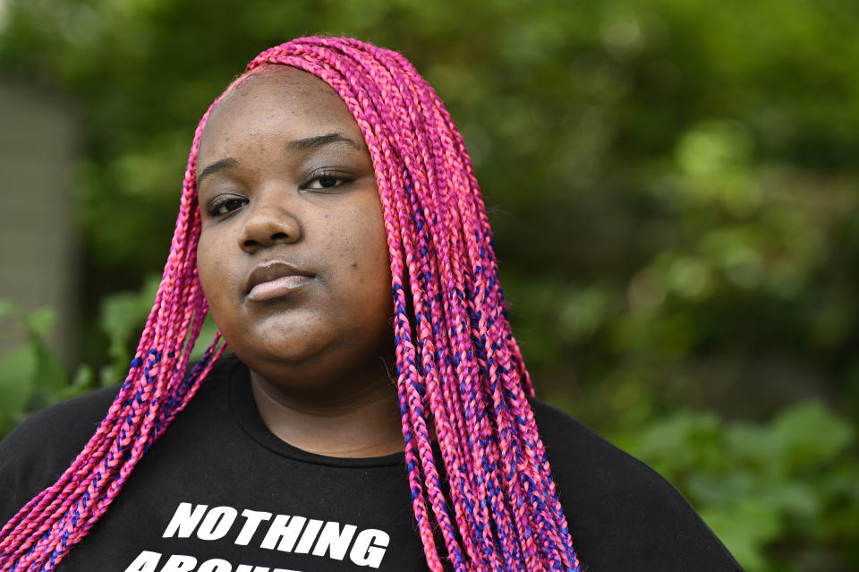 Victoria Bradley, 19, poses for a picture outside of her home, Sunday, Sept. 17, 2023, in Detroit. Historians say braids and other hairstyles served as methods of communication across African societies. After slavery was abolished, Black American hair became political. Although the Civil Rights Act of 1964 banned discrimination on the basis of race, color, religion, sex, and national origin, Black people continue to face professional and social stigma for not adopting grooming habits that fit white European beauty standards and norms. (AP Photo/Jose Juarez)