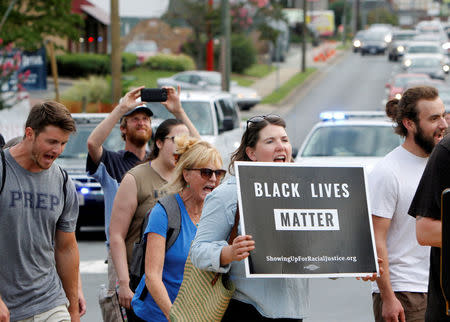 Participants of "Charlottesville to D.C: The March to Confront White Supremacy" begin a ten-day trek to the nation's capital from Charlottesville, Virginia, U.S. August 28, 2017. REUTERS/Julia Rendleman