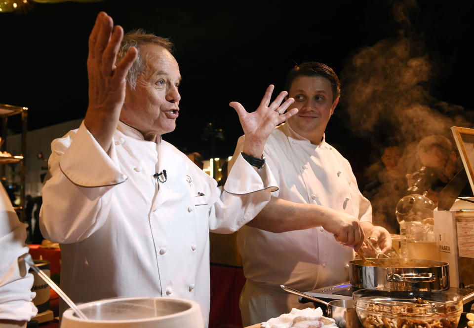 Wolfgang Puck, creator of the menu for the 89th Academy Awards Governors Ball, talks to reporters as chef Eric Klein looks on during a press preview for the event on Thursday, Feb. 16, 2017, in Los Angeles. The 89th Academy Awards will be held at the Dolby Theatre on Sunday, Feb. 26, in Los Angeles. (Photo by Chris Pizzello/Invision/AP)