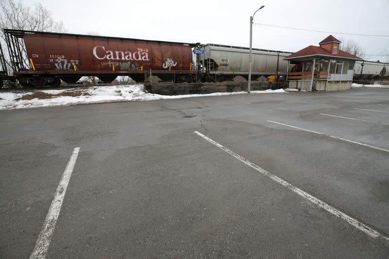 An idle Canadian National Railway (CN Rail) train is parked next to an empty VIA Rail commuter station after weeks of blockades, in Trenton