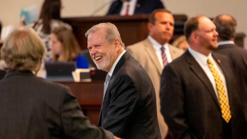 Senate President Pro Tempore talks with colleagues on the Senate floor at the General Assembly in Raleigh on Wednesday, Aug 16, 2023. Travis Long/tlong@newsobserver.com