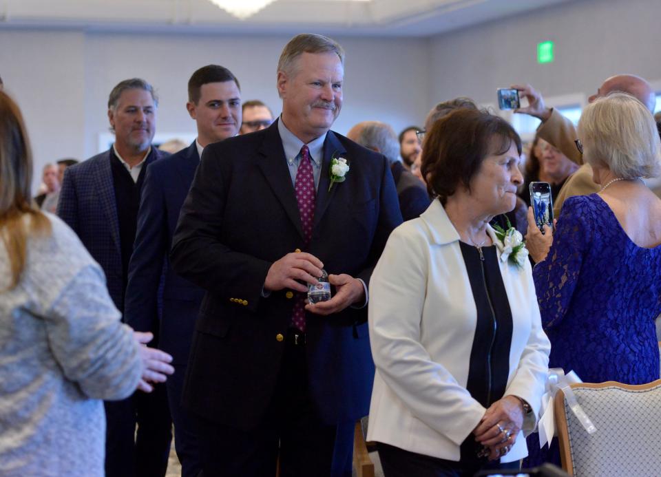 Mary Henderson, Glenn Davis, Mitchell Jordan and Lance Berkman, right to left, walk in with their fellow Cape Cod Baseball League Hall of Fame inductees for a ceremony on Sunday the Wequassett Resort and Golf Club in Harwich.