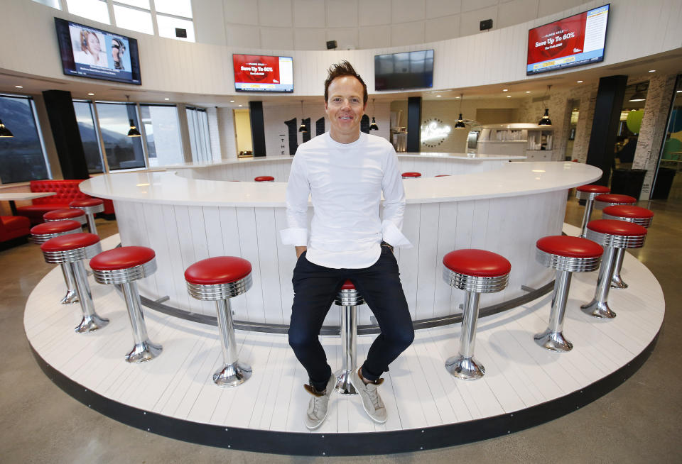 FILE - In this Feb. 2, 2018, file photo, Qualtrics CEO Ryan Smith poses in the Hub at the company's headquarters in Orem, Utah. The NBA's Board of Governors unanimously approved the sale Friday, Dec. 18, 2020, of the Utah Jazz to a group led by technology entrepreneur Ryan Smith, ending the Miller family’s 35-year run as owners of the franchise. (Jeffrey D. Allred/The Deseret News via AP, File)