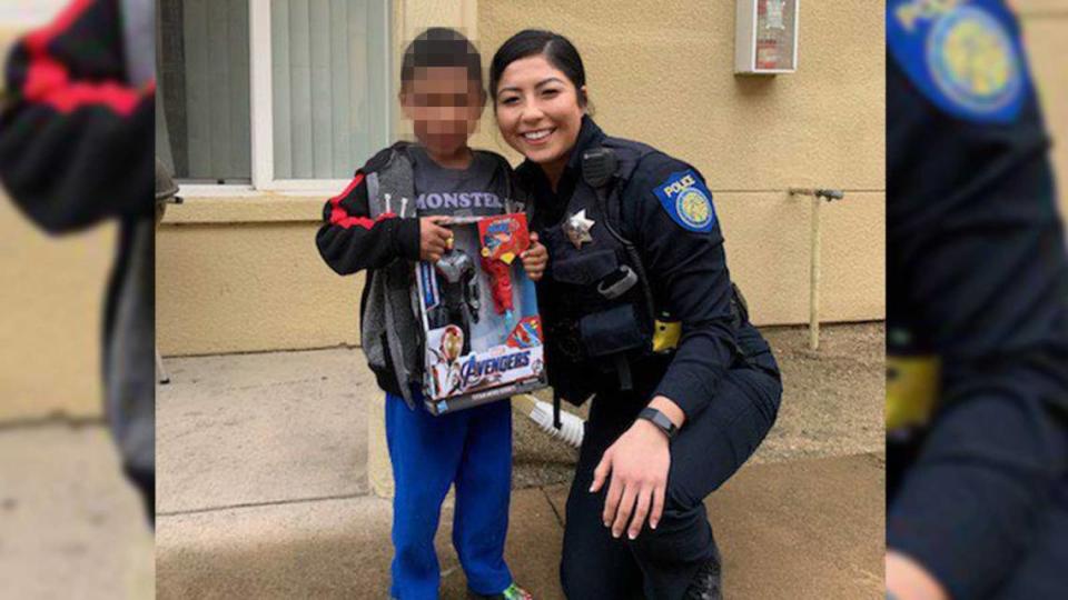 Sacramento Police Officer Alexa Palubicki is seen in a social media post by the department on Dec. 15, 2019, during a call for service where officers provided a family with Christmas gifts. Palubicki was arrested Thursday, May 6, 2021, following a 10-month investigation over a traffic stop. The Sacramento County District Attorney’s Office has filed charges against Palubicki for falsifying a police report.