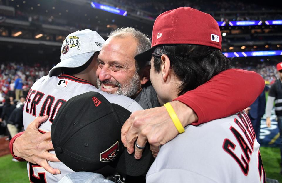 Manager Torey Lovullo celebrates with Geraldo Perdomo and Corbin Carroll after winning NLCS Game 7.