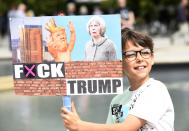 <p>A Scotland United Against Trump demonstrator holds an anti-Trump sign near the Scottish Parliament in Edinburgh before marching through the city to a “Carnival of Resistance” to protest the visit of President Trump to the U.K. (Photo: Lesley Martin/PA Images via Getty Images) </p>