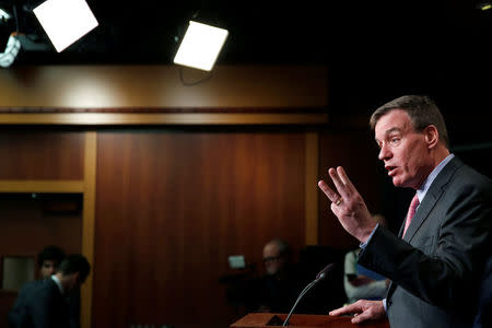 Vice Chairman of the Senate Intelligence Committee Senator Mark Warner (D-VA) speaks to the media about the committee's findings and recommendations on threats to election infrastructure on Capitol Hill in Washington, U.S., March 20, 2018. REUTERS/Joshua Roberts