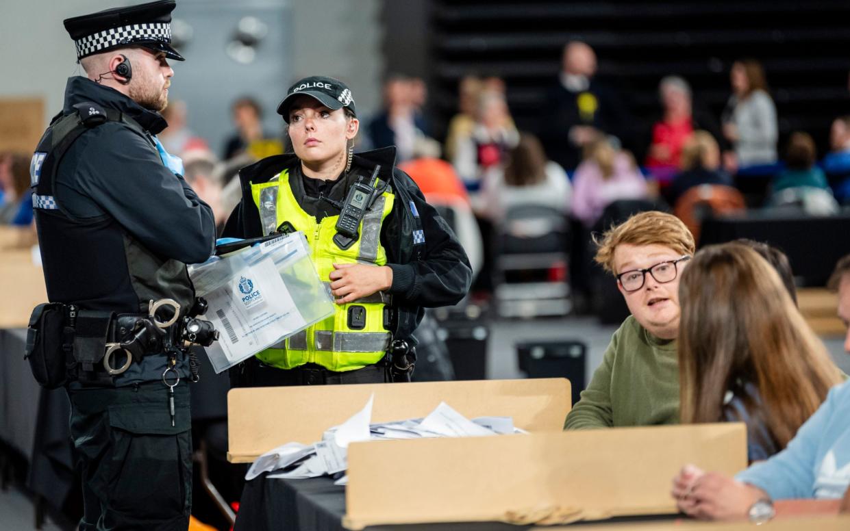 Police officers at the Emirates Arena in Glasgow during the count