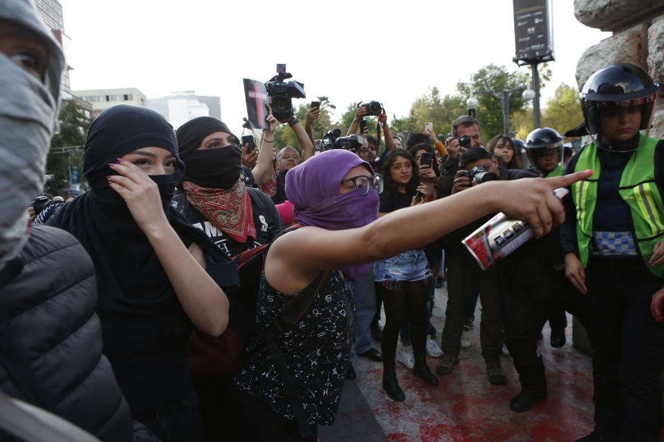 Women protest against the latest murder of two women, in Mexico City, Saturday, Jan. 25, 2020. During the past couple of weeks two women activists, attorney Yunuen Lopez Sanchez and Isabel Cabanillas de la Torre where murdered by unknown assailants. (AP Photo/Ginnette Riquelme)