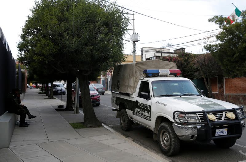 A police patrol vehicle is seen at the entrance of Mexico's embassy in La Paz