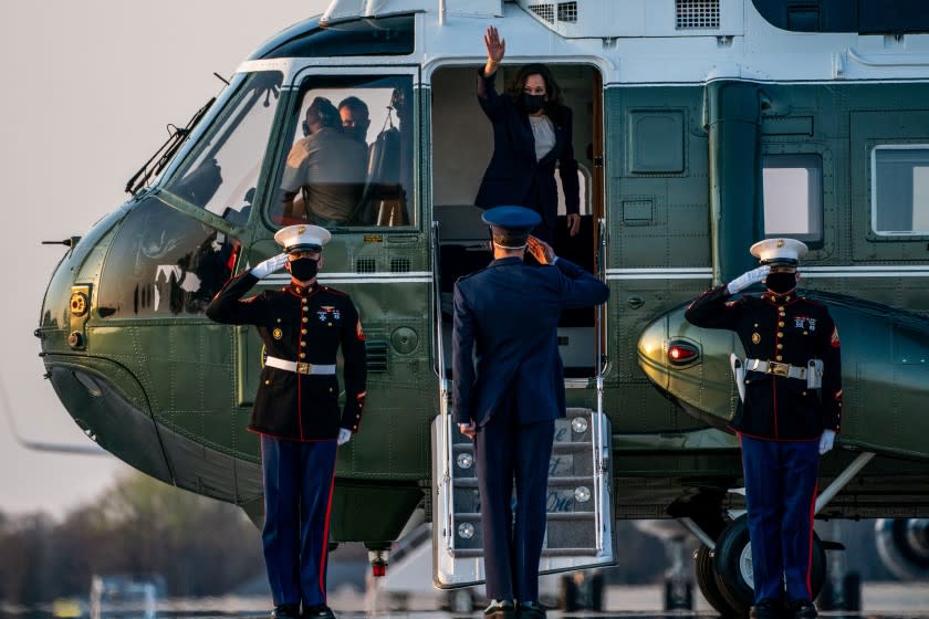 ANDREWS AIR FORCE BASE, MD - APRIL 06: Vice President Kamala Harris waves after walking with Lt Col Grant McNelis, 89th Operations Support Squadron/Mission Operations Officer, to Marine 2 on Tuesday, April 6, 2021 in Andrews Air Force Base, MD. Harris returns to Washington from Los Angeles, after a stop in Chicago, IL. (Kent Nishimura / Los Angeles Times)