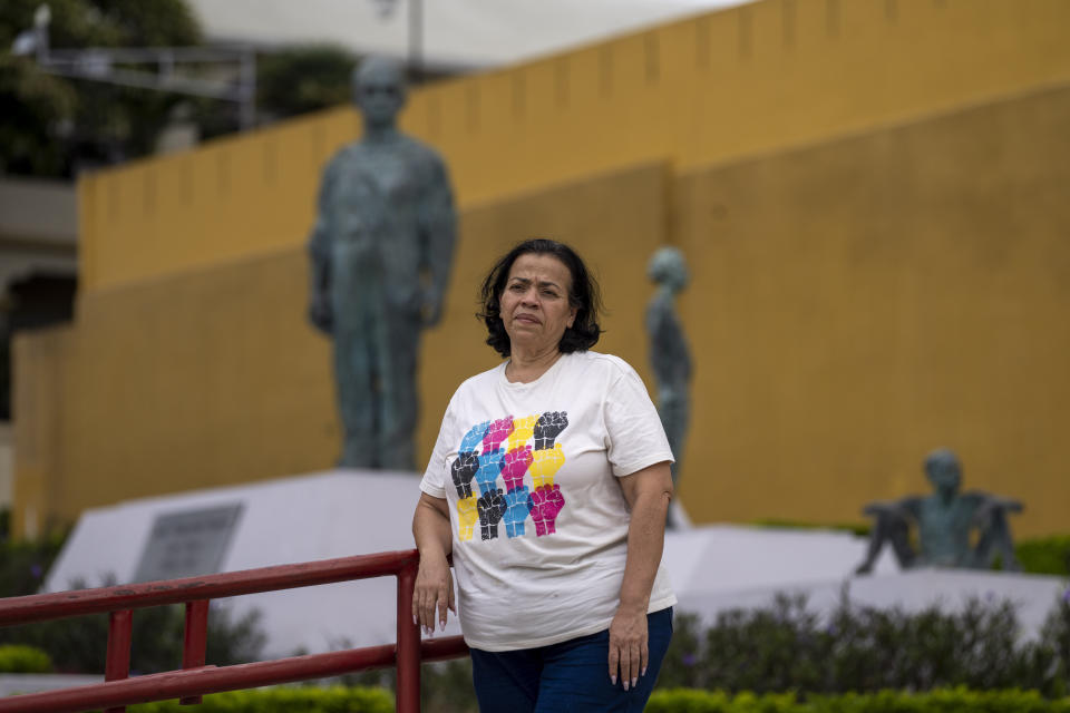 Nicaraguan asylum-seeker Lludely Aburto Ruiz poses for photos at Democracy Square in San Jose, Costa Rica, Saturday, Aug. 27, 2022. The 56-year-old said she was getting ready to retire from a nonprofit that offered education and health services but had to leave Nicaragua after months of police harassment in front of her home and being frequently mentioned in pro-government press outlets and attacked on social media due to her activism with the political opposition. (AP Photo/Moises Castillo)