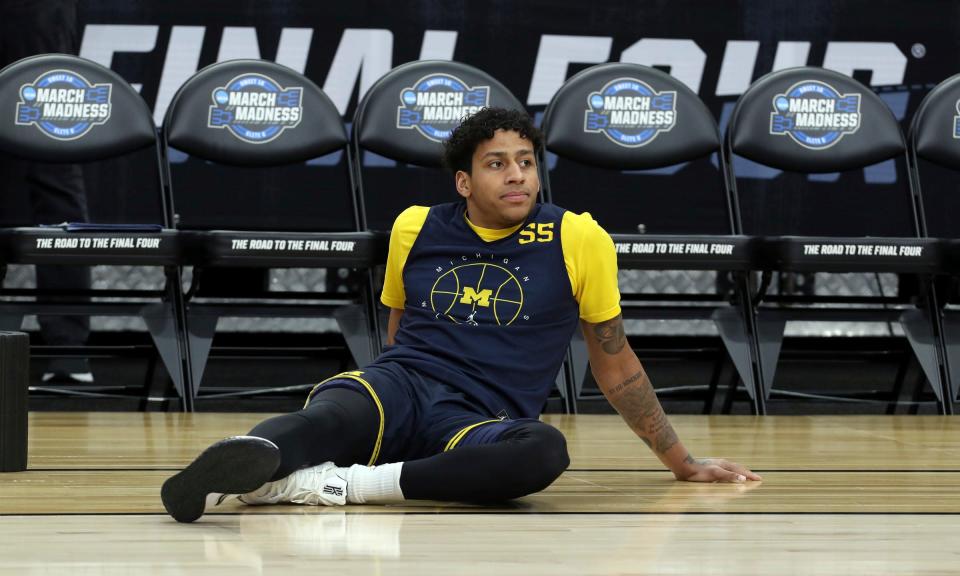 Michigan guard Eli Brooks stretches before practicing for the Sweet 16 game against Villanova on Wednesday, March 23, 2022, at the AT&amp;T Center in San Antonio.