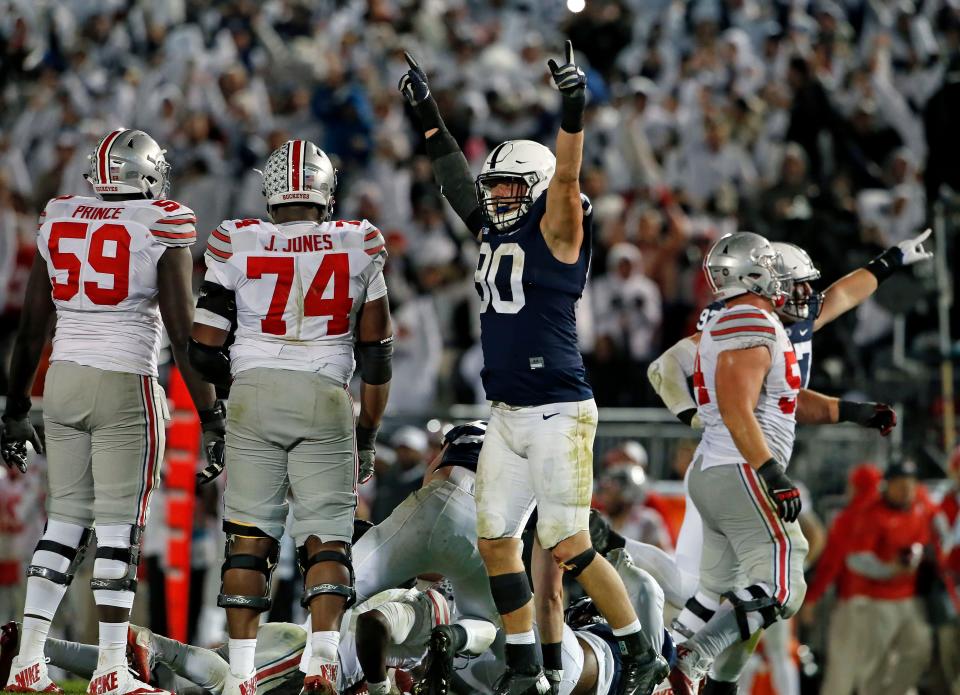 Penn State's Garrett Sickels (90) celebrates after a fourth-down sack of Ohio State quarterback J.T. Barrett  during the second half of an NCAA college football game in State College, Pa., Saturday, Oct. 22, 2016. Penn State won 24-21. (AP Photo/Chris Knight)