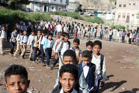 Students walk into their classes at the teacher's house, who turned it into a makeshift free school that hosts 700 students, in Taiz, Yemen October 18, 2018. Picture taken October 18, 2018. REUTERS/Anees Mahyoub