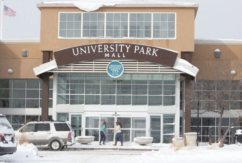 In this January 2015 file photo, shoppers walk into the University Park Mall food court in Mishawaka. South Bend Tribune Photo/BECKY MALEWITZ