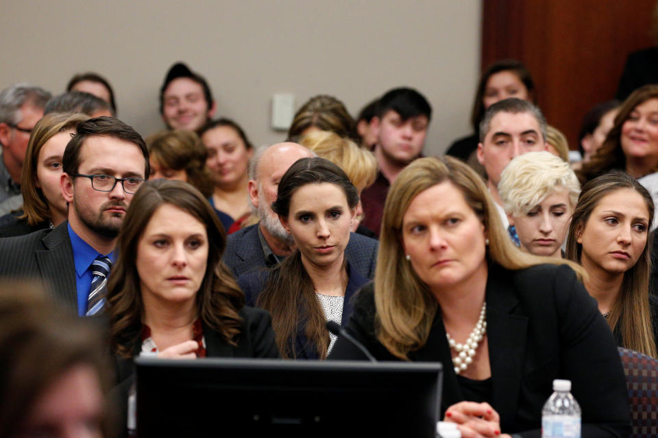 Rachael Denhollander (center) listens as Larry Nassar is sentenced. (Photo: Brendan McDermid / Reuters)