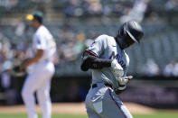 Miami Marlins' Nick Gordon, right, celebrates as he runs the bases following his three-run home run against Oakland Athletics pitcher Joe Boyle, background, during the first inning of a baseball game Sunday, May 5, 2024, in Oakland, Calif. (AP Photo/Godofredo A. Vásquez)