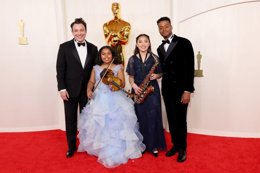 HOLLYWOOD, CALIFORNIA – MARCH 10: Ben Proudfoot (L), Kris Bowers (R), and guests attend the 96th Annual Academy Awards on March 10, 2024 in Hollywood, California. (Photo by Mike Coppola/Getty Images)