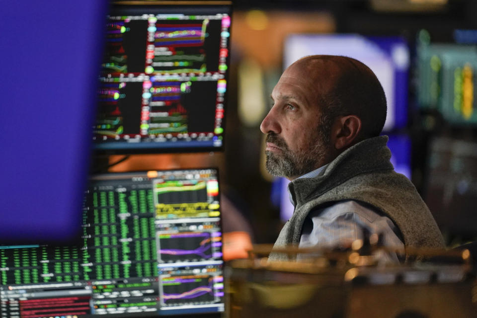 Traders work on the floor at the New York Stock Exchange in New York, Tuesday, Oct. 4, 2022. (AP Photo/Seth Wenig)