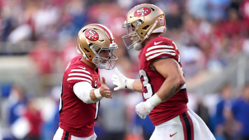Purdy and McCaffrey celebrate a play against the New York Giants during the second quarter in the game at Levi's Stadium on September 21, 2023. - Thearon W. Henderson/Getty Images