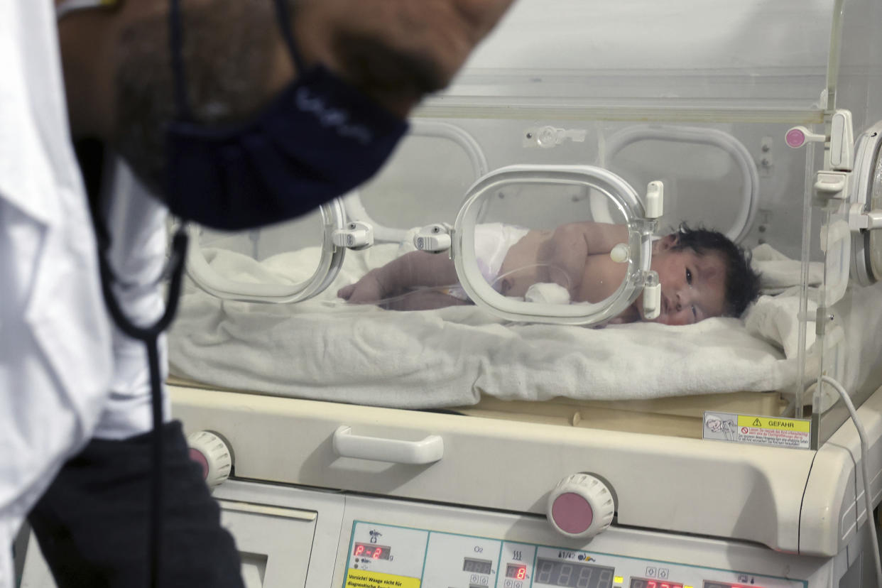 A baby girl who was born under the rubble caused by an earthquake that hit Syria and Turkey receives treatment inside an incubator at a children's hospital in the town of Afrin, Aleppo province, Syria, Tuesday, Feb. 7, 2023. Residents in a northwest Syrian town discovered a crying infant whose mother gave birth to her while buried underneath the rubble of a five-story apartment building leveled by this week's devastating earthquake, relatives and a doctor said Tuesday. (AP Photo/Ghaith Alsayed)