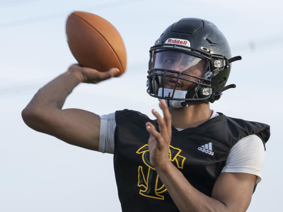 Quarterback Uriah Neloms throws a pass on July 29, 2024, during practice at San Tan Charter School in Gilbert.