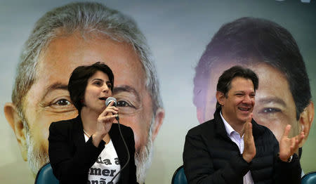 Fernando Haddad (R), former Sao Paulo mayor and member of Workers' Party (PT), and Manuela D'avila of the Communist Party of Brazil (PCdoB) attend a media conference in Sao Paulo, Brazil August 7, 2018. REUTERS/Paulo Whitaker