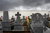 <p>A member of the Endiablada brotherhood walks in a cemetery to pray for the deceased fellow believers and relatives during a traditional festival in Almonacid del Marquesado, Spain, Feb. 2, 2017. (Photo: Daniel Ochoa de Olza/AP) </p>