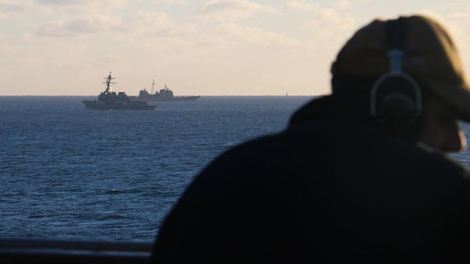 Seaman Rafael Mendez stands watch aboard the dock landing ship USS Carter Hall (LSD 50) while the guided-missile destroyer USS Oscar Austin (DDG 79) and the guided-missile cruiser USS Philippine Sea (CG 58) transit alongside debris from a high-altitude surveillance balloon. Carter Hall is the lead ship in debris recovery efforts led by the Navy, in joint partnership with the U.S. Coast Guard, with multiple units in support of the effort, including ships, aircraft, and an Explosive Ordnance Disposal mobile diving and salvage unit. At the direction of the President of the United States and with the full support of the Government of Canada, U.S. fighter aircraft under U.S. Northern Command authority engaged and brought down a high altitude surveillance balloon within sovereign U.S. airspace and over U.S. territorial waters Feb. 4, 2023. Active duty, Reserve, National Guard, and civilian personnel planned and executed the operation, and partners from the U.S. Coast Guard, Federal Aviation Administration, and Federal Bureau of Investigation ensured public safety throughout the operation and recovery efforts.