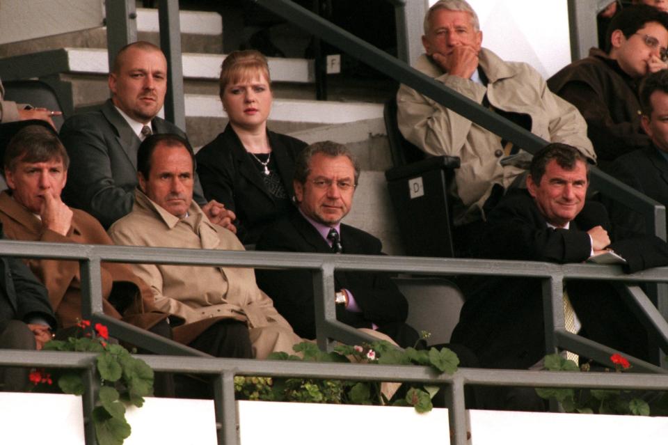 Tottenham Hotspur manager George Graham (left) watches the match alongside his chairman Alan Sugar (centre) and director of football David Pleat (right)
