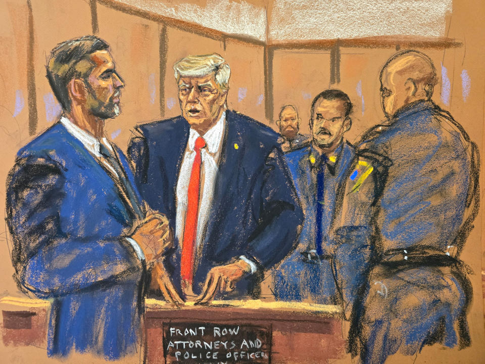 Former U.S. President Donald Trump chats with his son Eric Trump during his criminal trial in New York City on April 30, 2024 in this courtroom sketch. (Jane Rosenberg/Reuters)
