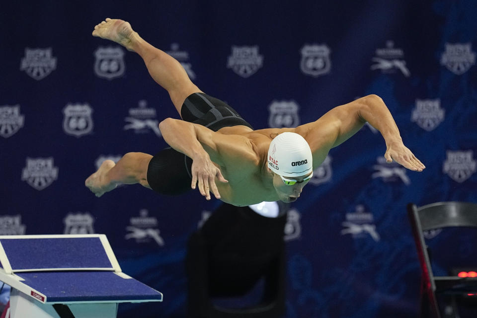 Ryan Held starts on his way to winning the 50-meter freestyle at the U.S. national championships swimming meet, Saturday, July 1, 2023, in Indianapolis. (AP Photo/Darron Cummings)