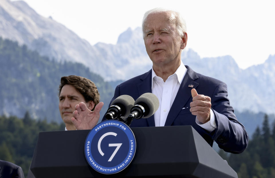 U.S. President Joe Biden speaks next to Canadian Prime Minister Justin Trudeau during the first day of the G7 leaders' summit at Bavaria's Schloss Elmau castle, near Garmisch-Partenkirchen, Germany, Sunday, June 26, 2022. (Lukas Barth/Pool photo via AP)