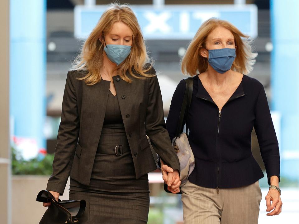 Theranos founder and former CEO Elizabeth Holmes (L) walks with her mother Noel Holmes as they arrive for Elizabeth Holmes's trial at the Robert F. Peckham Federal Building on November 17, 2021 in San Jose, California.