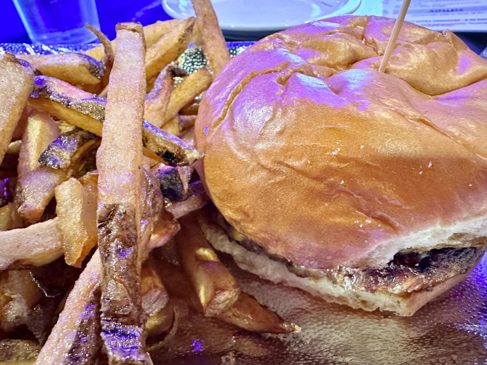 Open flame grilled burger with fresh cut fries is a tasty option at Falcone's Tavern in Perry Township.