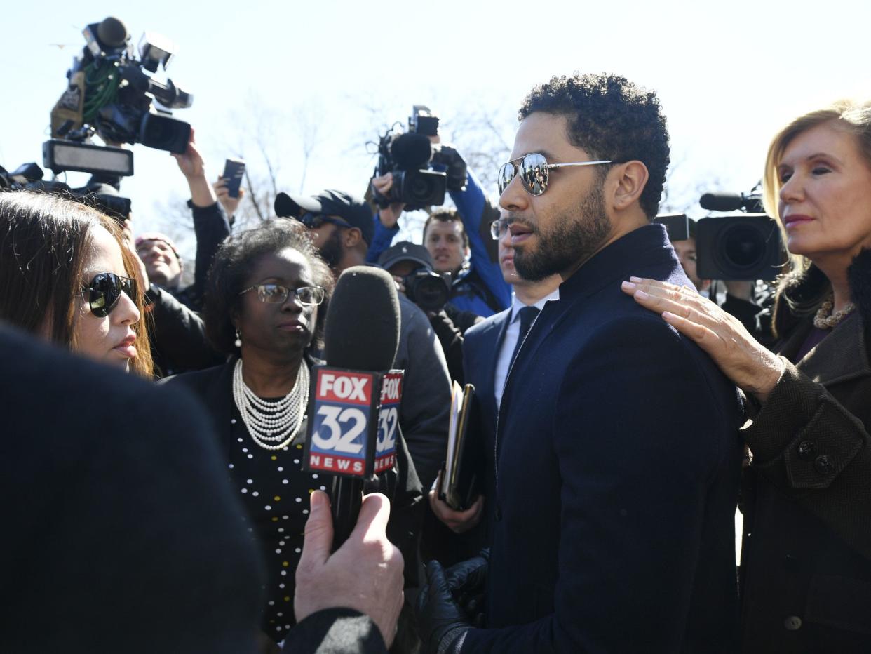 Actor Jussie Smollett talks with the media while leaving Cook County Court after his charges were dropped Tuesday, March 26, 2019, in Chicago.