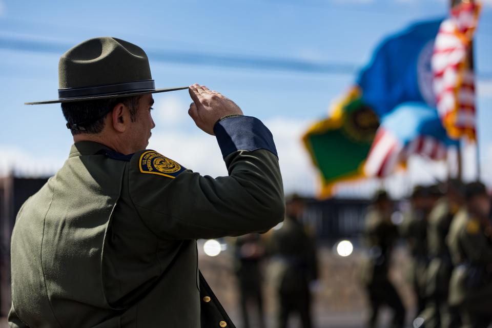 U.S. Border Patrol Agents of the El Paso Sector salute during the presentation of colors as the El Paso Sector unveils a memorial honoring fallen agents on Wednesday, Jan. 24, at the El Paso Sector Headquarters.