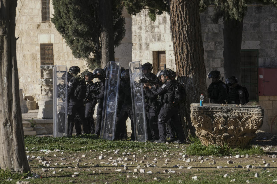 Israeli security forces take position during clashes with Palestinians demonstrators at the Al Aqsa Mosque compound in Jerusalem's Old City, Friday, April 15, 2022. (AP Photo/Mahmoud Illean)