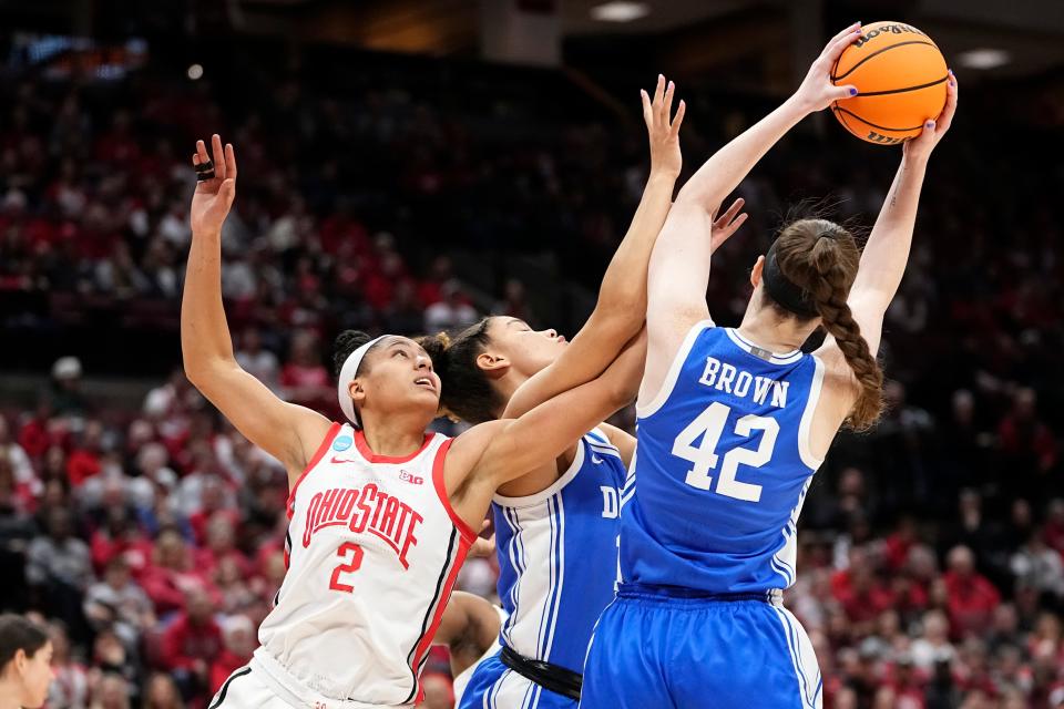 Mar 24, 2024; Columbus, OH, USA; Ohio State Buckeyes guard Taylor Thierry (2) fights for a rebound with Duke Blue Devils center Kennedy Brown (42) during the first half of the women’s NCAA Tournament second round at Value City Arena.