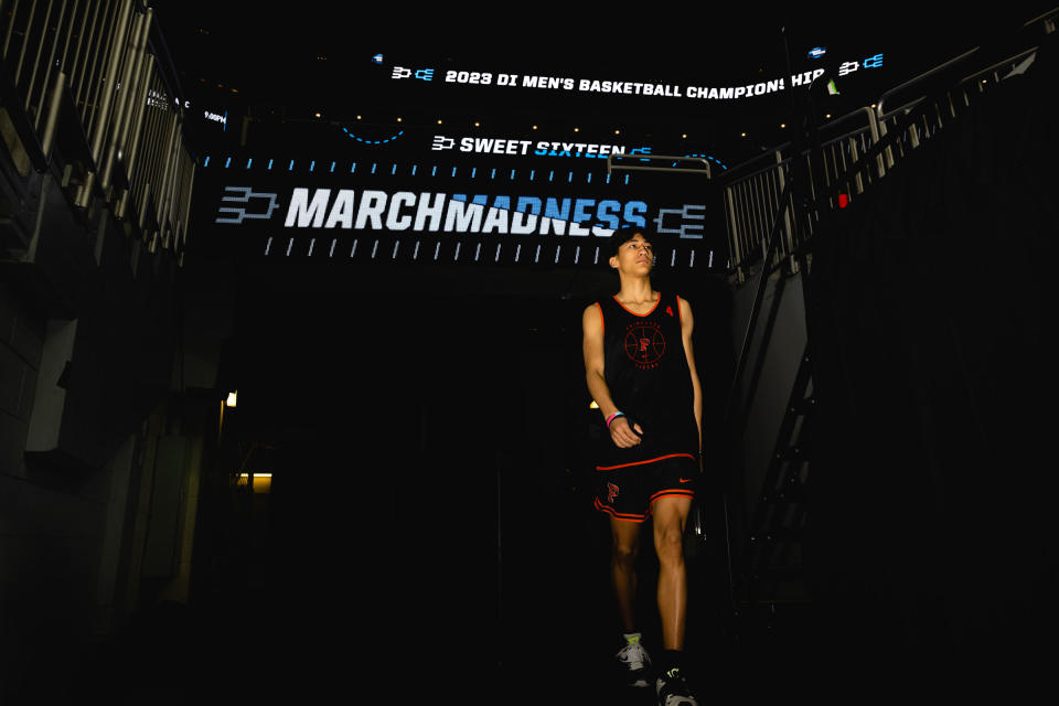 Xavian Lee walks onto the court for practice at the KFC Yum! Center in Louisville, Ky., on March 23, 2023.<span class="copyright">Jon Cherry for TIME</span>