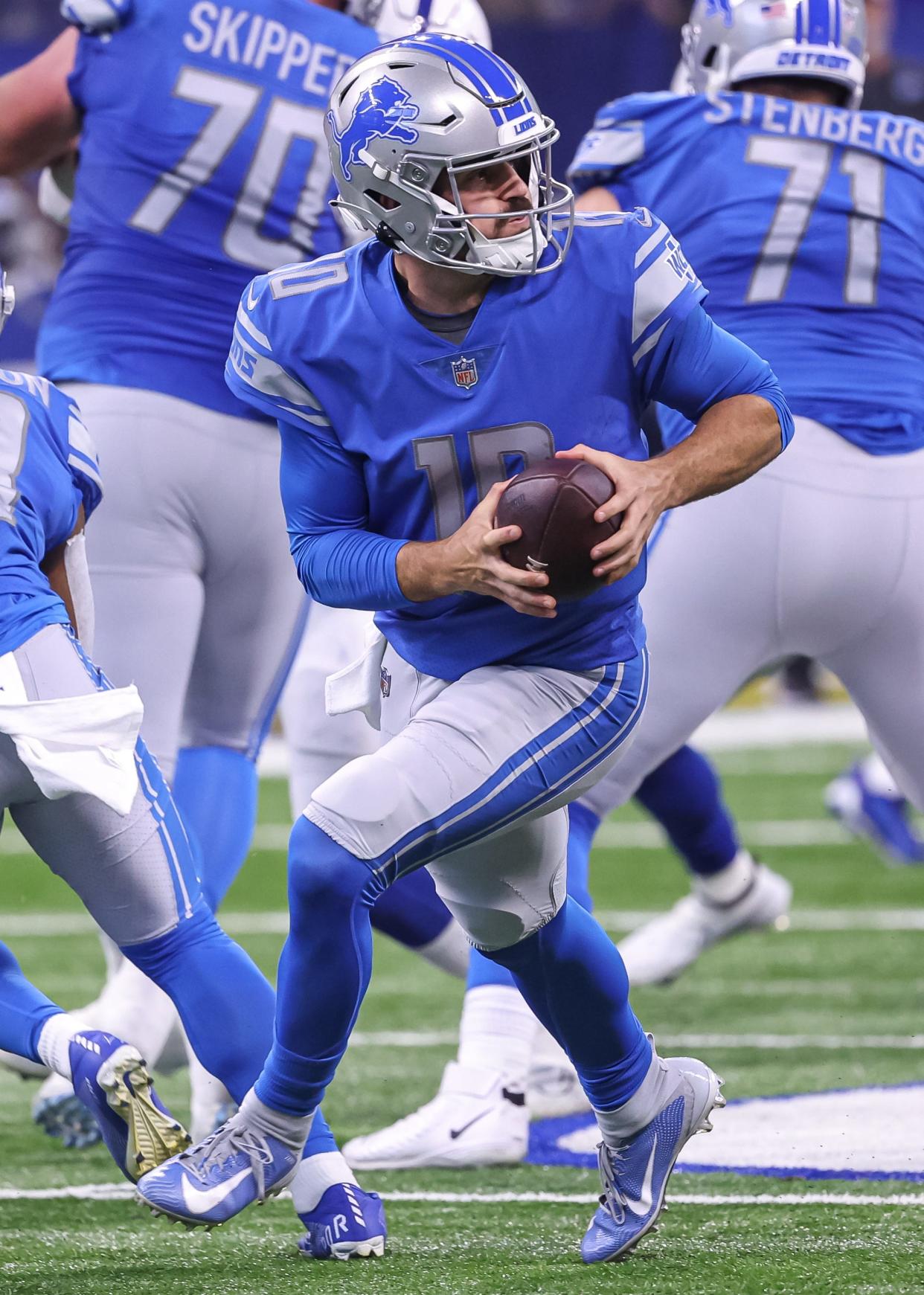 David Blough #10 of Detroit Lions rolls out of the pocket during the first half against the Indianapolis Colts at Lucas Oil Stadium on August 20, 2022 in Indianapolis.