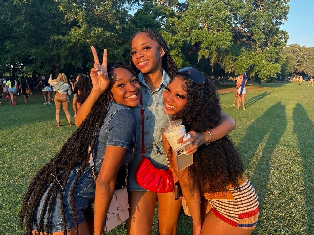 Toni Wallen, Brooklyn Clay and Gabrielle Banks pose for a picture at Daffin Park on Friday, April 19.