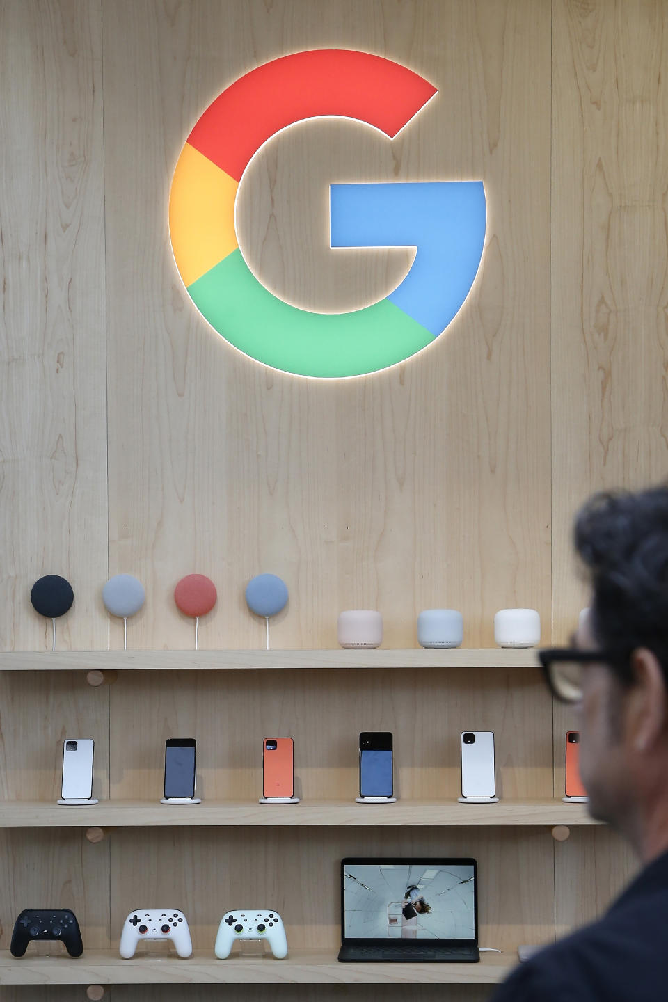 FILE - In this Jan. 8, 2020, file photo, the Google exhibit building offers a multitude of products offering the Google Assistant during the CES tech show in Las Vegas. Google broke Australian law by misleading users about personal location data collected through Android mobile devices, a judge found Friday, April 16, 2021. (AP Photo/Ross D. Franklin, File)