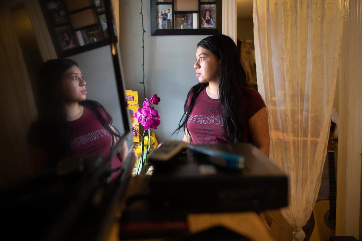 <span class="caption">For immigrants like Juana, from El Salvador, migration -- not coronavirus -- is the main cause of separation from family. Norwalk, Connecticut, March 25, 2020.</span> <span class="attribution"><a class="link " href="https://www.gettyimages.com/detail/news-photo/undocumented-immigrant-juana-from-el-salvador-looks-from-news-photo/1214779312?adppopup=true" rel="nofollow noopener" target="_blank" data-ylk="slk:John Moore/Getty Images;elm:context_link;itc:0;sec:content-canvas">John Moore/Getty Images</a></span>