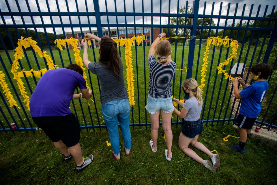 Teachers from Capital City Public Charter School in Northwest Washington and others decorate their school fence with yellow paper to spell the words Black Lives Matter on June 18, 2020. In an apparent backlash against the teaching of “anti-racism” lessons in schools, proposed legislation has cropped up in at least a dozen states attacking a once obscure legal premise — critical race theory, which questions how the legacy of slavery still affects American society today.