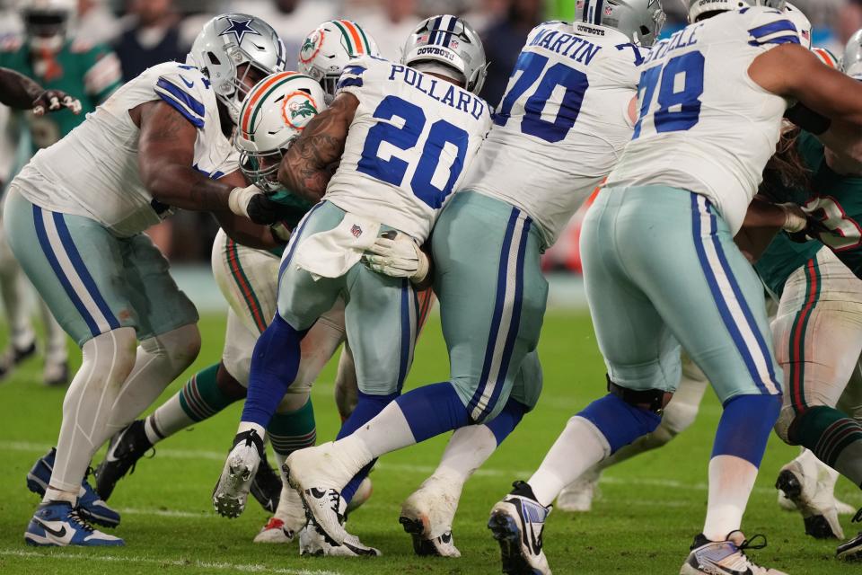 Miami Dolphins defensive tackle Zach Sieler (92) stops Dallas Cowboys running back Tony Pollard (20) during the second half of an NFL game at Hard Rock Stadium in Miami Gardens, Dec. 24, 2023.